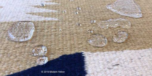Fiber protection showing beaded drops on a rug